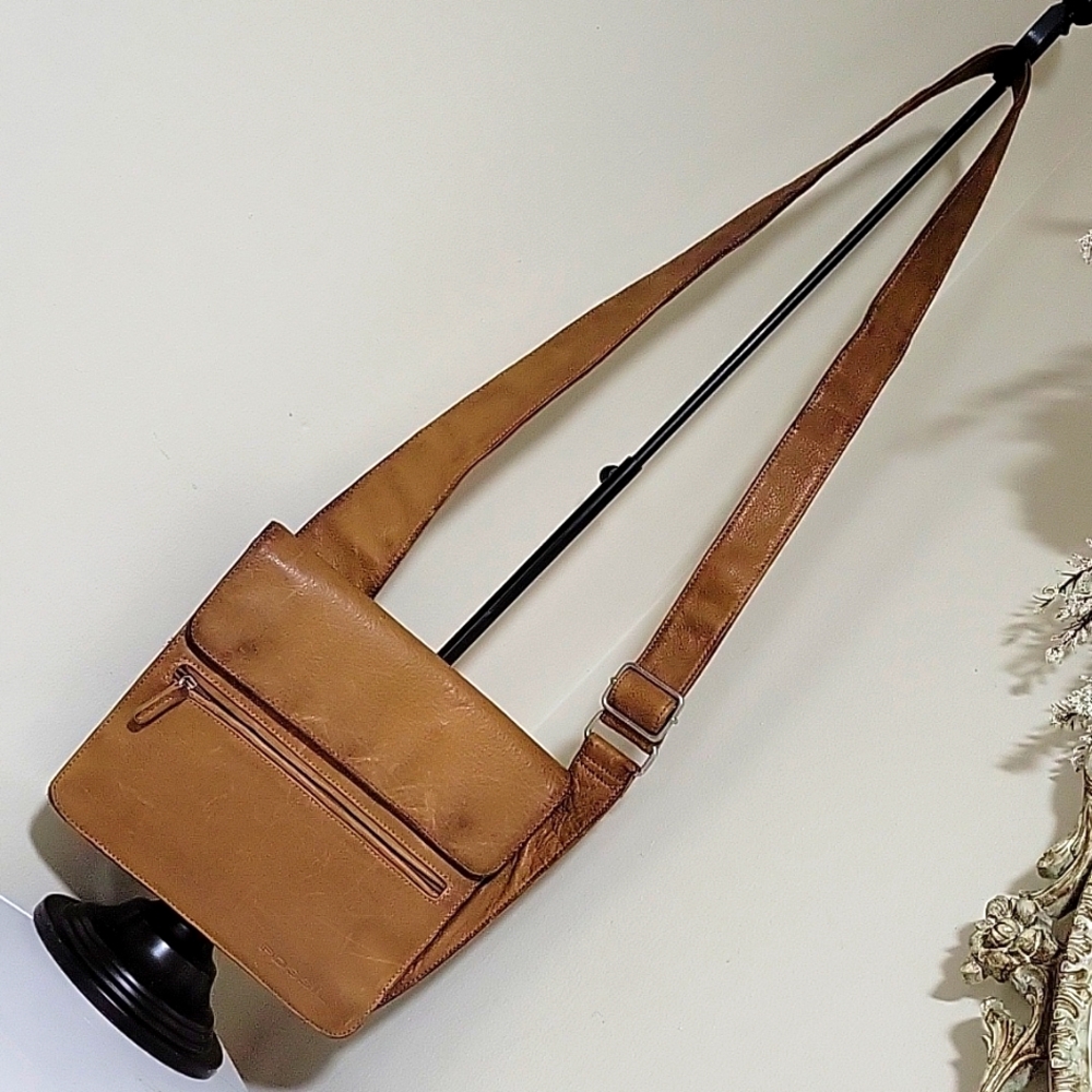 Fossil crossbody leather tan bag .